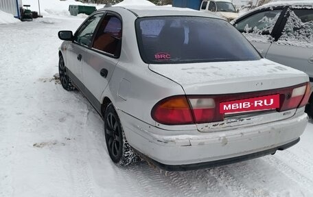 Mazda 323, 1998 год, 150 000 рублей, 11 фотография