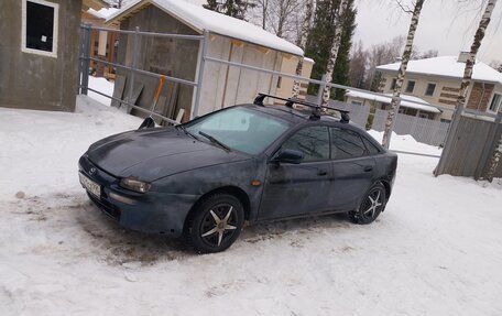 Mazda 323, 1998 год, 150 000 рублей, 12 фотография