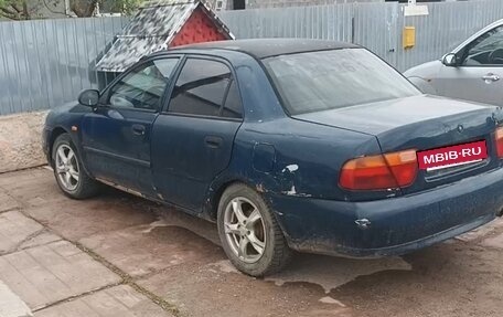 Mitsubishi Carisma I, 1997 год, 100 000 рублей, 2 фотография