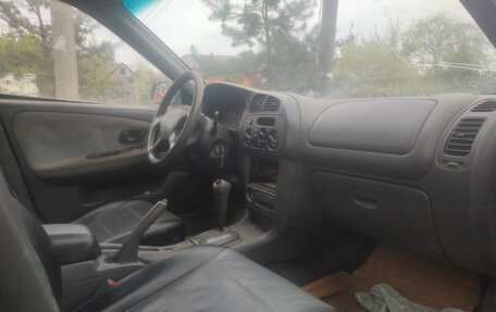 Mitsubishi Mirage VI рестайлинг, 1999 год, 65 000 рублей, 6 фотография