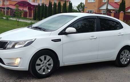 KIA Rio III рестайлинг, 2012 год, 970 000 рублей, 34 фотография