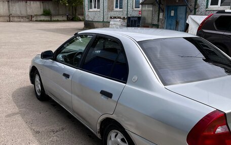 Mitsubishi Mirage VI рестайлинг, 2001 год, 250 000 рублей, 5 фотография
