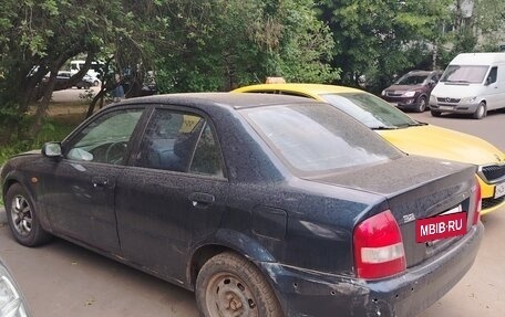Mazda 323, 1999 год, 195 000 рублей, 10 фотография