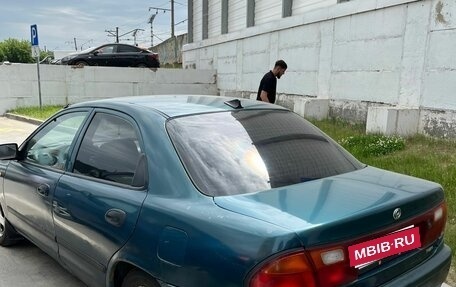 Mazda 323, 1997 год, 145 000 рублей, 8 фотография