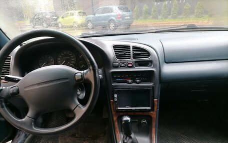 Mazda 323, 1995 год, 300 000 рублей, 10 фотография