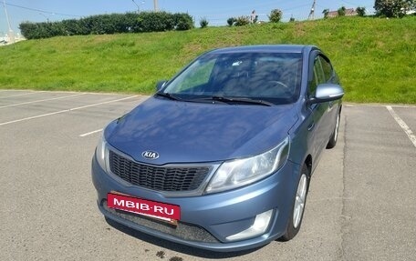 KIA Rio III рестайлинг, 2013 год, 18 фотография