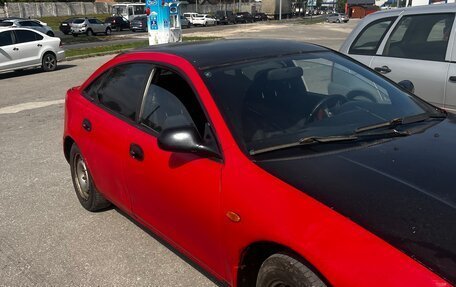 Mazda 323, 1998 год, 105 000 рублей, 13 фотография