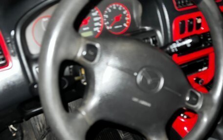 Mazda 323, 1998 год, 105 000 рублей, 39 фотография