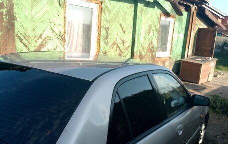 Ford Laser IV, 2002 год, 250 000 рублей, 3 фотография