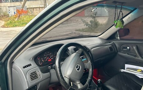 Mazda 323, 2000 год, 300 000 рублей, 13 фотография