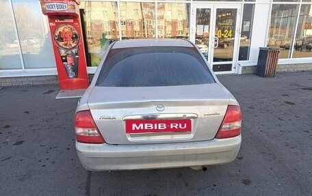 Mazda 323, 1999 год, 310 000 рублей, 9 фотография