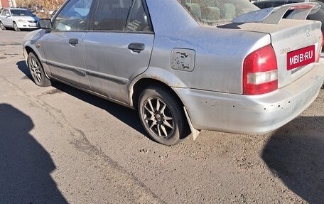 Mazda 323, 1999 год, 310 000 рублей, 5 фотография