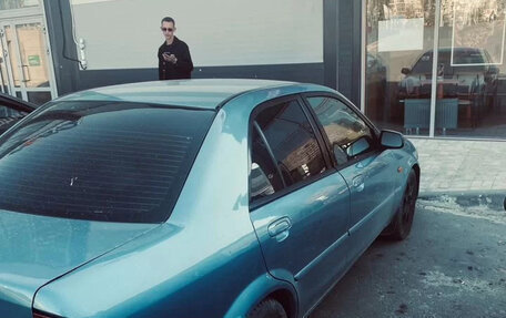 Ford Laser IV, 2002 год, 200 000 рублей, 5 фотография