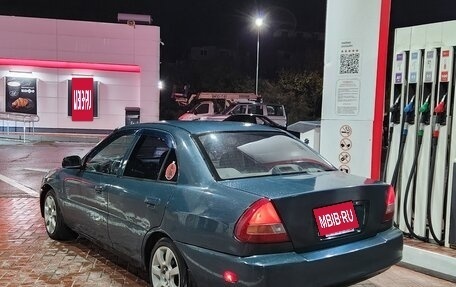 Mitsubishi Mirage VI рестайлинг, 1998 год, 230 000 рублей, 8 фотография