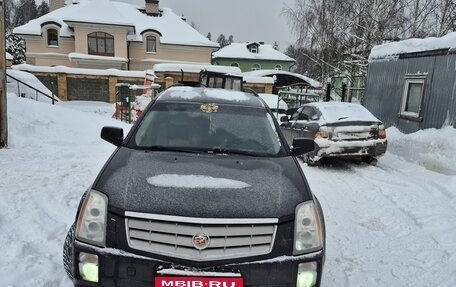 Cadillac SRX II рестайлинг, 2009 год, 750 000 рублей, 1 фотография