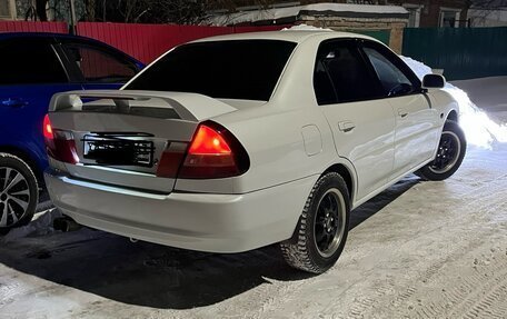 Mitsubishi Mirage VI рестайлинг, 2000 год, 420 000 рублей, 9 фотография