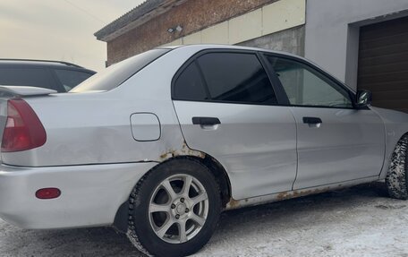 Mitsubishi Mirage VI рестайлинг, 2000 год, 280 000 рублей, 10 фотография