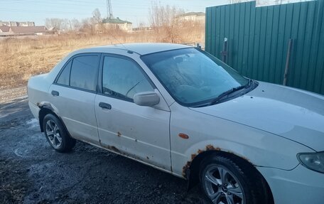 Mazda Familia, 2001 год, 130 000 рублей, 9 фотография