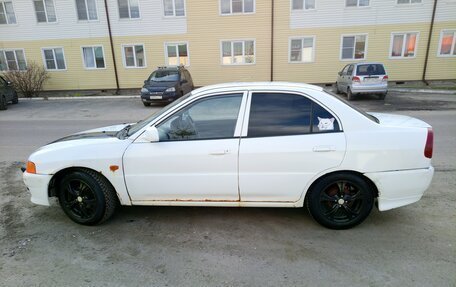 Mitsubishi Mirage VI рестайлинг, 2000 год, 250 000 рублей, 2 фотография