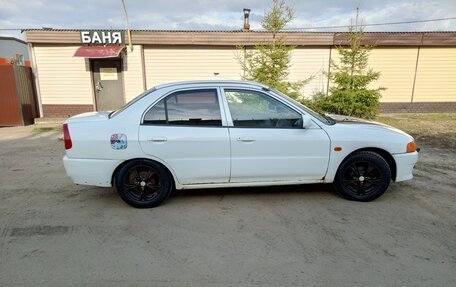 Mitsubishi Mirage VI рестайлинг, 2000 год, 250 000 рублей, 7 фотография