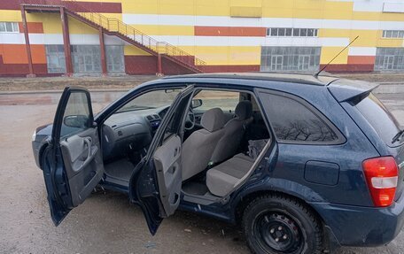 Mazda Familia Y10, 1999 год, 340 000 рублей, 4 фотография