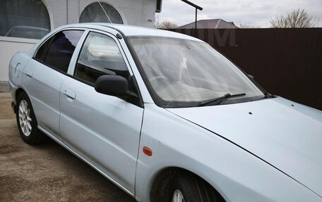 Mitsubishi Mirage VI рестайлинг, 1998 год, 250 000 рублей, 13 фотография