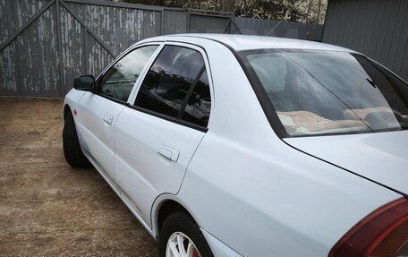 Mitsubishi Mirage VI рестайлинг, 1998 год, 250 000 рублей, 11 фотография