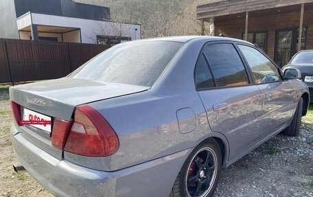 Mitsubishi Mirage VI рестайлинг, 1998 год, 290 000 рублей, 7 фотография