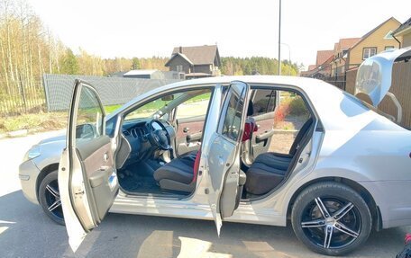 Nissan Tiida, 2010 год, 700 000 рублей, 7 фотография