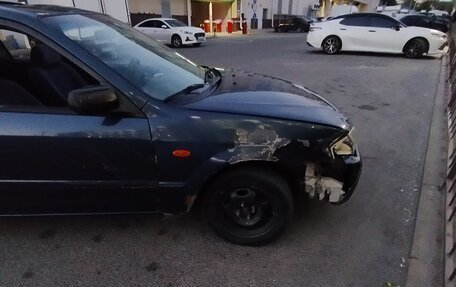 Mazda 323, 1999 год, 160 000 рублей, 14 фотография