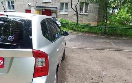 KIA Carens III (RP), 2011 год, 945 000 рублей, 5 фотография