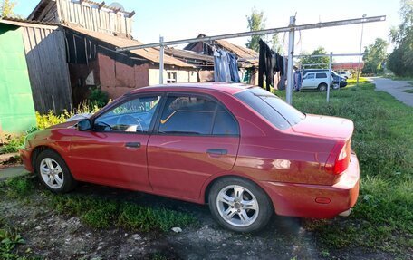 Mitsubishi Mirage VI рестайлинг, 2001 год, 500 000 рублей, 5 фотография