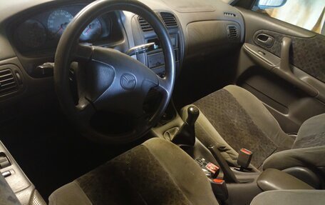 Mazda 323, 1998 год, 150 000 рублей, 3 фотография