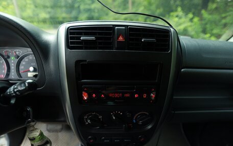 Suzuki Jimny, 2012 год, 1 250 000 рублей, 17 фотография