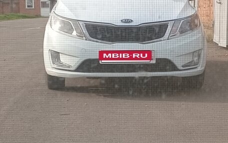 KIA Rio III рестайлинг, 2013 год, 1 050 000 рублей, 21 фотография
