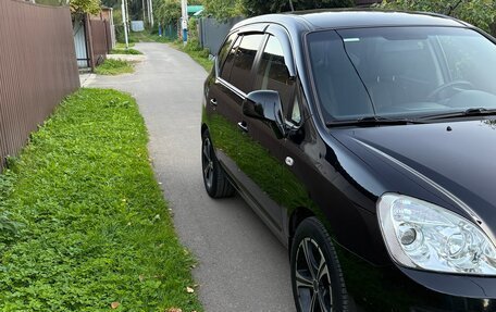 KIA Carens III (RP), 2011 год, 1 035 000 рублей, 3 фотография
