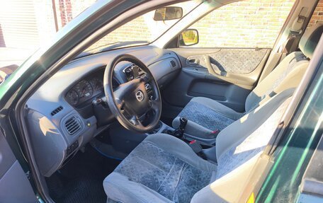 Mazda 323, 1998 год, 280 000 рублей, 10 фотография